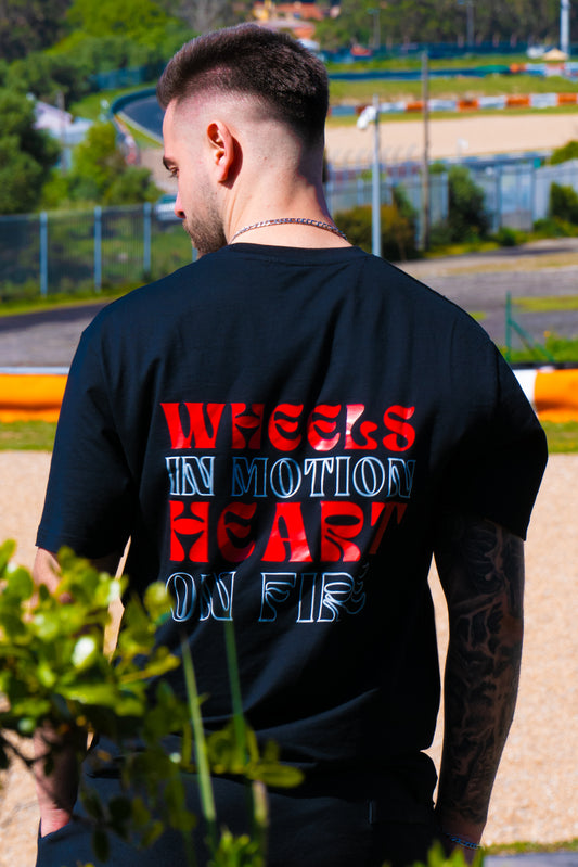 “WHEELS IN MOTION HEART ON FIRE”